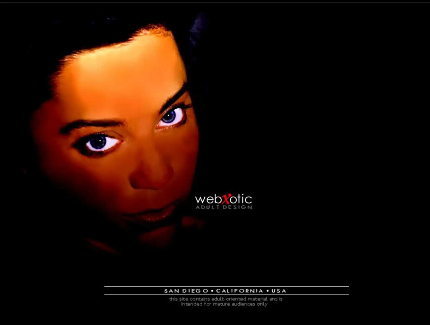 A dramatically lit woman's face emerges from darkness, staring at the viewer, with the title webxotic floating on a dark background
