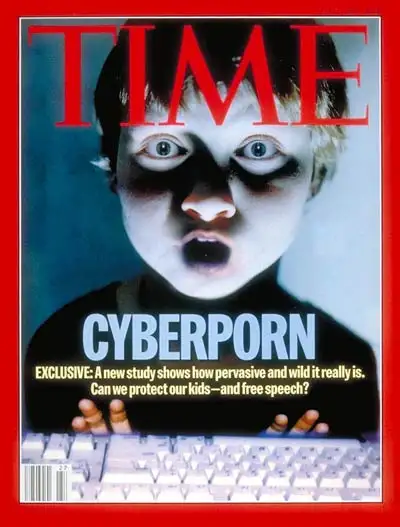 On a vintage Time Magazine cover, a dramatically lit photo illustration depicts a young boy staring wide-eyed, mouth hanging open, in front of a computer keyboard, with the large headline "Cyberporn"